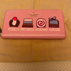Kate Spade brand new zip around pink wallet.